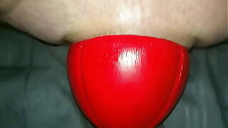 Huge 12 cm wide Red Football sliding out of my Bore up close in Arrested Motion