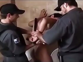 Two latino security guards turtle-dove a shoplifter